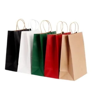 Six custom kraft paper bags in different colors, including black, white, green, red, and natural brown, each featuring twisted handles.