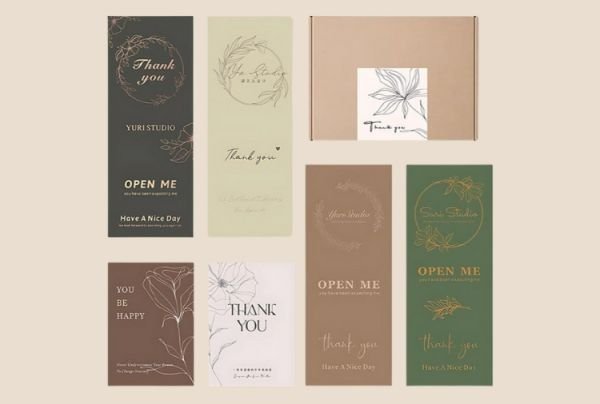 Collection of custom labels and die-cut stickers featuring various 'Thank You' messages in different fonts and designs on green, brown, and beige backgrounds.